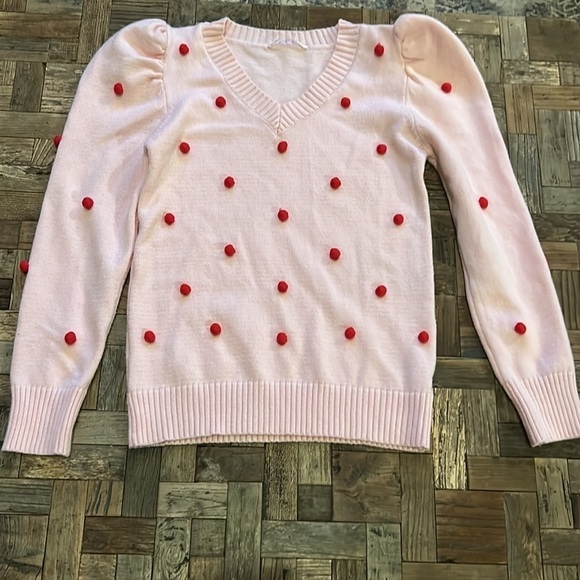 Pink V Neck Sweater With Puff Sleeves and Red Pom Poms - Picture 2 of 11